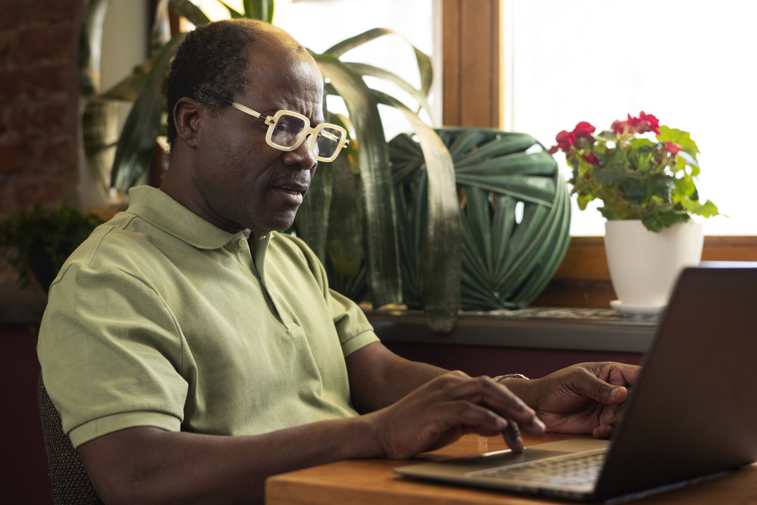 Participant using a laptop at a restaurant