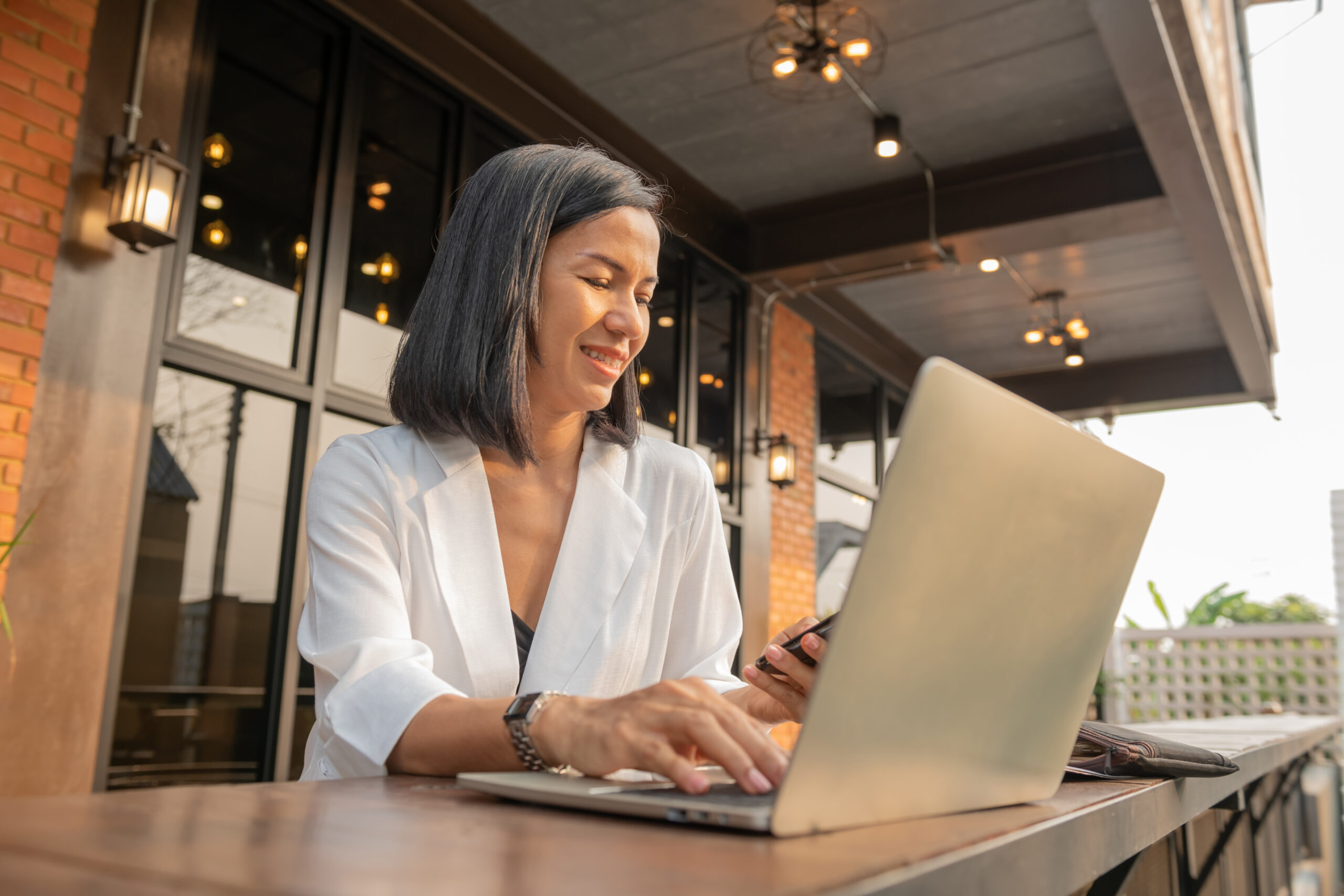 Participant using a laptop in a cafe